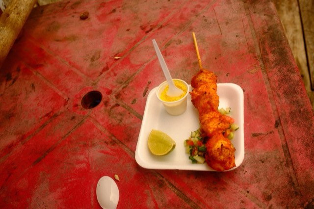 Fish skewer on a red table from Max Nicholson's archive