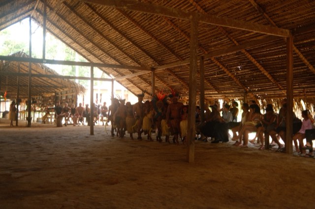 Dancers and audience in a thatched hall from Max Nicholson's archive