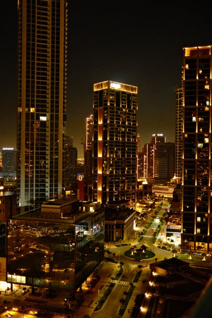 City towers illuminated at night from Max Nicholson's archive