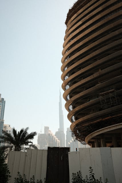 Burj Khalifa beside a curved tower from Max Nicholson's archive