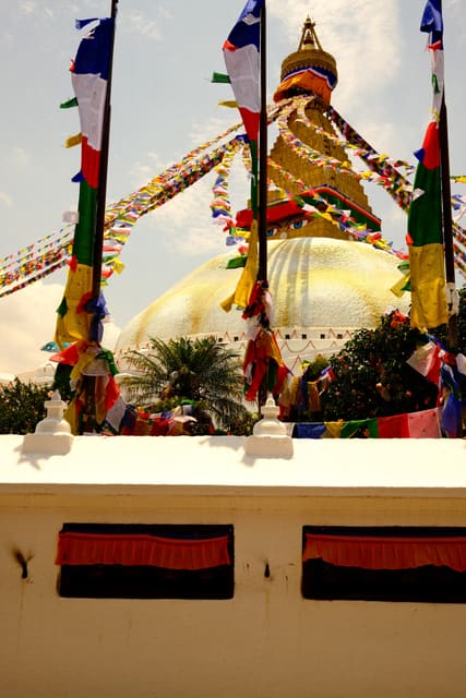 Boudhanath behind prayer flags from Max Nicholson's archive