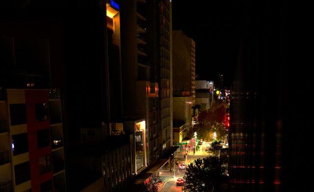 Red building on the night street from Max Nicholson's archive