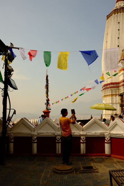 Visitor beneath the prayer flags from Max Nicholson's archive